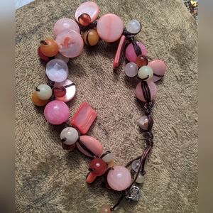 Pink vacation accessory stone and shell